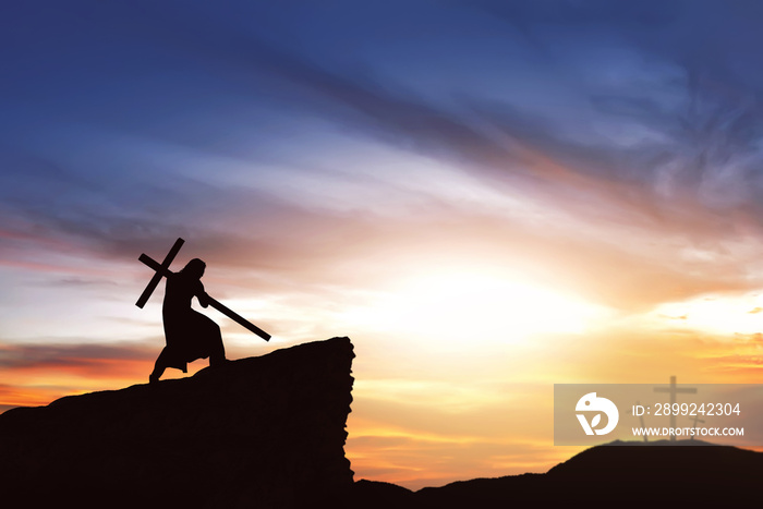 Silhouette of Jesus carry his cross