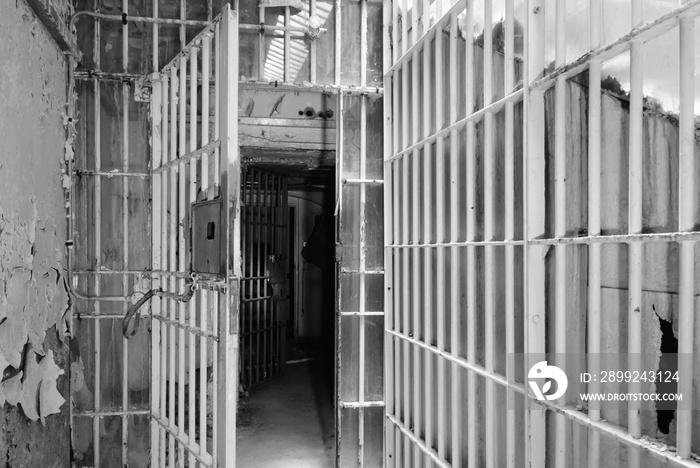 Open metal barred gates inside an old prison