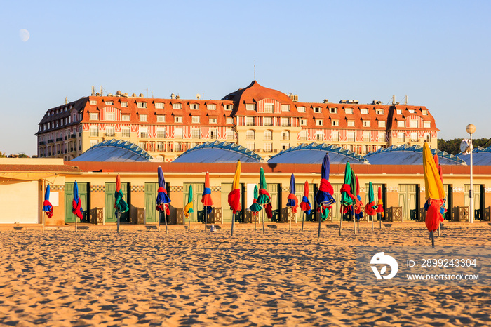 Colorful umbrellas on the sand beach of Deauville, Normandy, France.