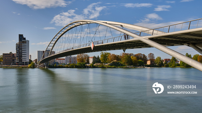 Low Angle View of Bridge Over River In City Against Sky