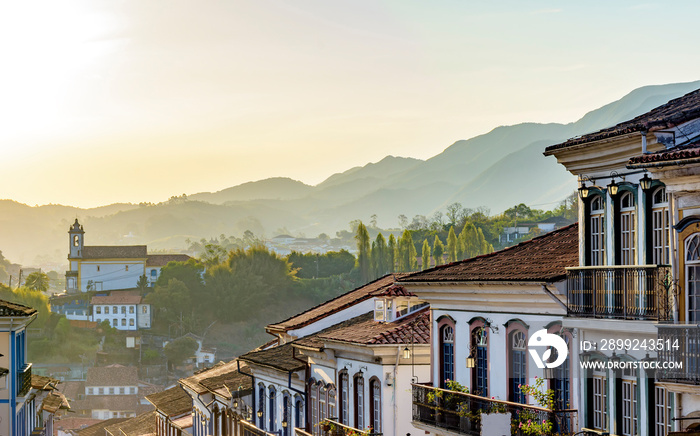 Old houses and churches in colonial architecture from the 18th century in the historic city of Ouro Preto in Minas Gerais, Brazil at sunset