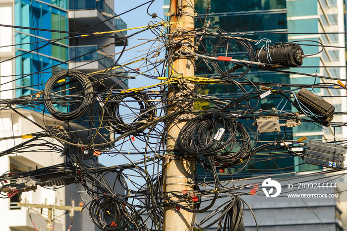 network of fiber optic cables installed on a utility pole