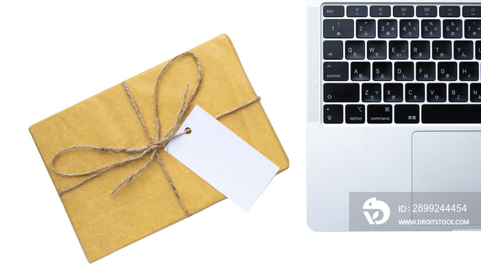 Laptop and gift box with tag for background and copy space