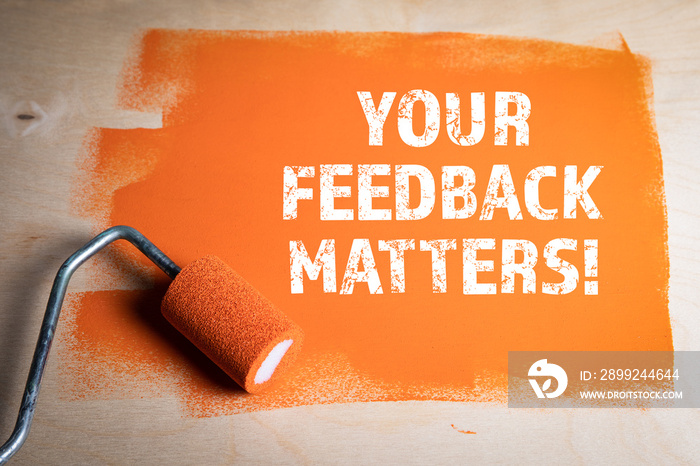 YOUR FEEDBACK MATTERS. Orange painted wooden surface