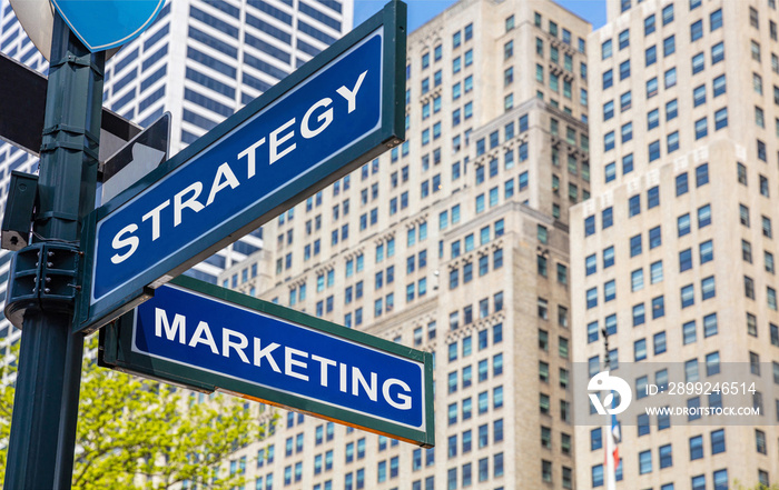 Strategy marketing crossroads street sign. Highrise buildings background,