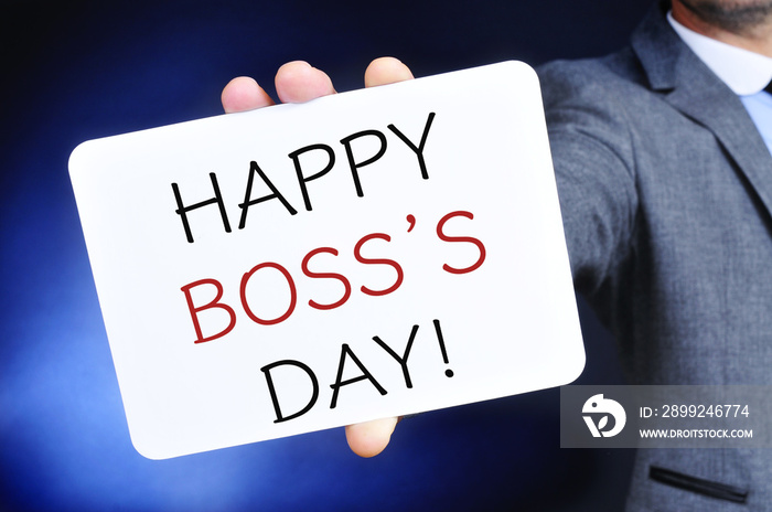 man with a signboard with the text happy boss day