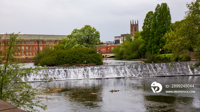 The river Derwent in Derby City Center showing weir, Council House and Cathedral