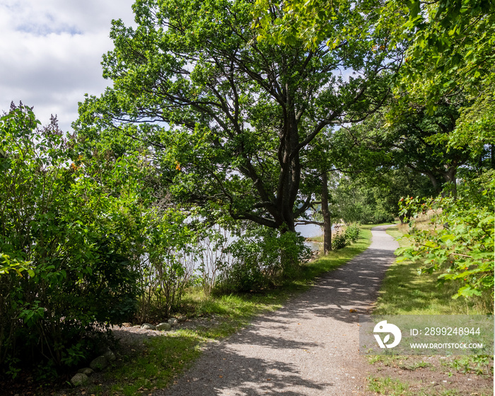 Gravel road along the sea shore in Lidingö, Stockholm, Sweden