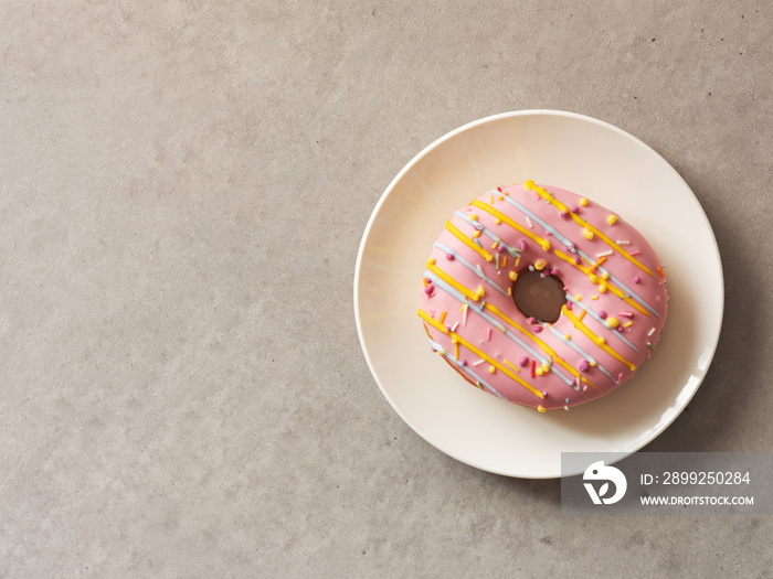 Donuts with icing sugar on a plate