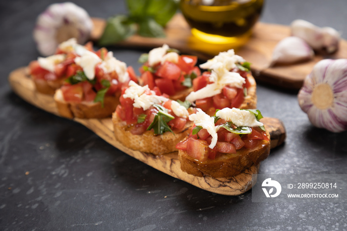 Italian bruschetta bread with tomato, basil and mozzarella cheese