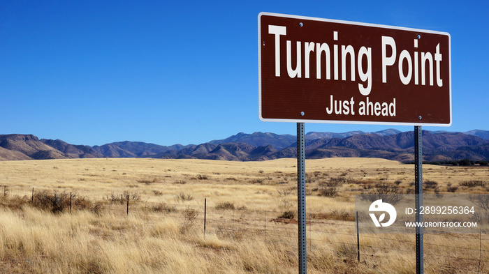 Turning Point Just Ahead brown road sign