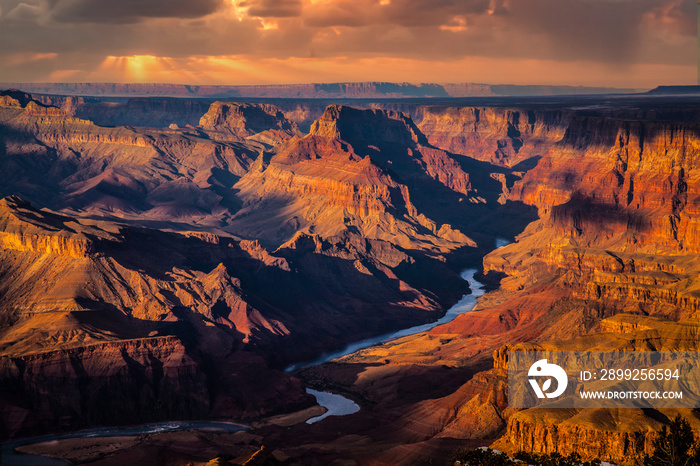 The Grand Canyon, Grand Canyon National Park, Arizona.  Photo taken from the South rim during a stormy sunset.  TheColorado River is visible at the canyon bottom.