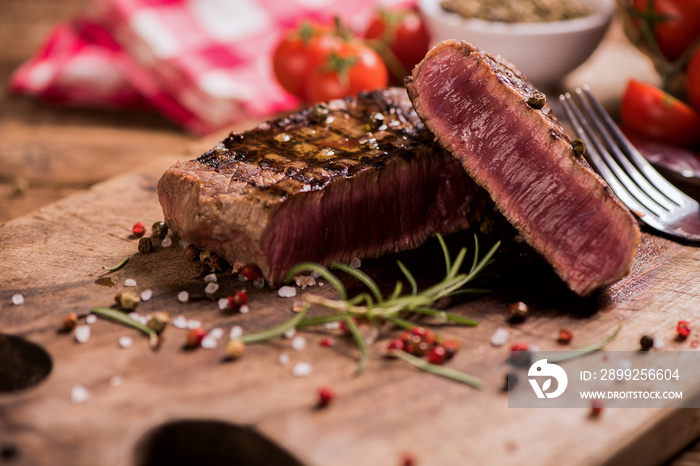 Delicious beef steak on wooden table, close-up