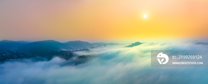 Aerial view of Xuan Tho suburbs near Da Lat city at morning with misty and sunrise sky. This place is considered most beautiful and peaceful place to watch sunrise in highlands of Vietnam