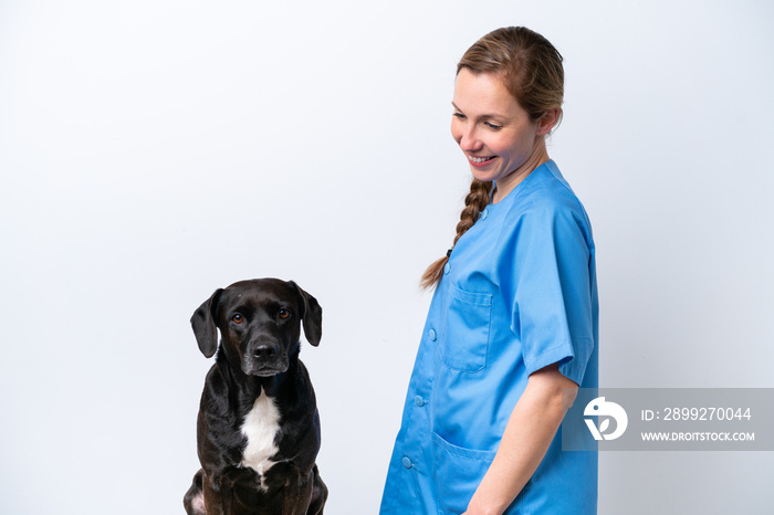 Young veterinarian woman with dog isolated on white background with happy expression