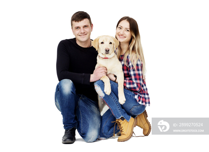 family embraces a dog labrador