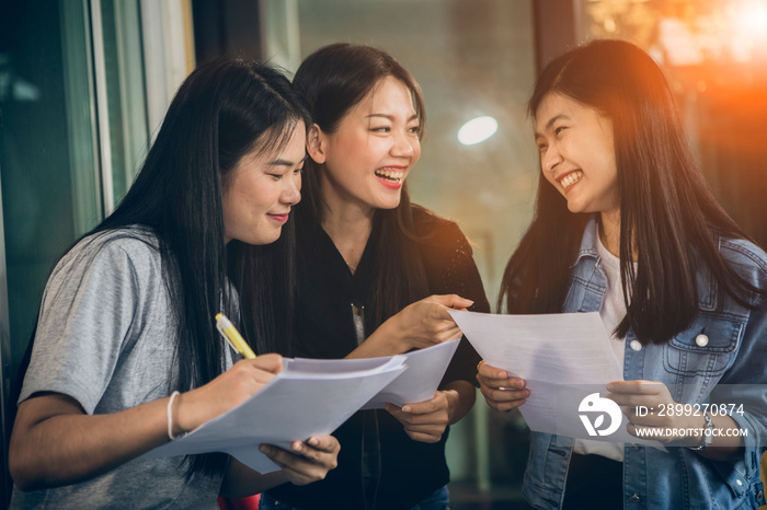 asian younger woman freelance talking with toothy smiling face in home office