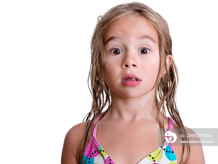 Surprised little blond girl with wet hair