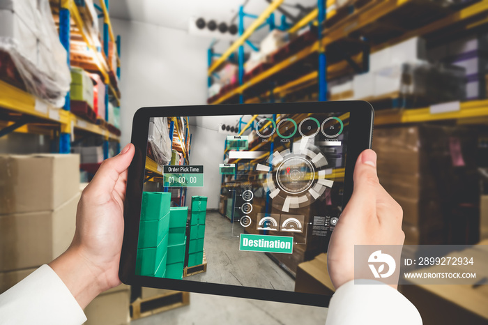 Smart warehouse management system using augmented reality technology to identify package picking and delivery . Future concept of supply chain and logistic business .