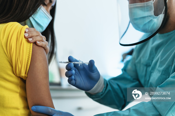 Medical worker doing vaccine injection to female patient for preventing and stop corona virus outbreak - Healthcare medicine and cure against covid19 disease concept