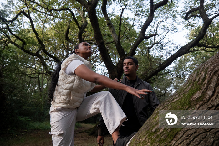 Portrait of couple standing on tree