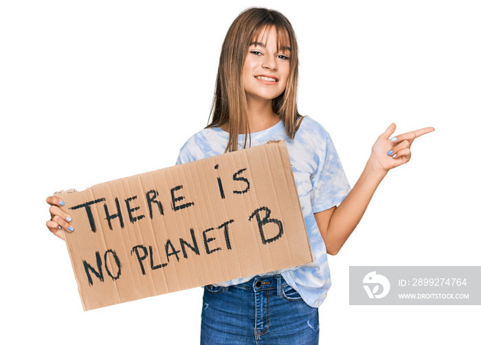 Teenager caucasian girl holding there is no planet b banner smiling happy pointing with hand and finger to the side