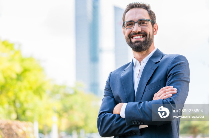 Close-up of smiling confident businessman wearing eyeglasses