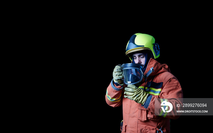 firefighter sadly putting on protective gear