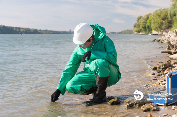 Pollution control inspector filling up sample container