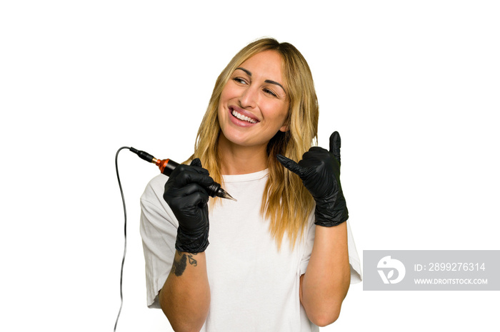 Tattoo artist caucasian woman isolated on green chroma background showing a mobile phone call gesture with fingers.