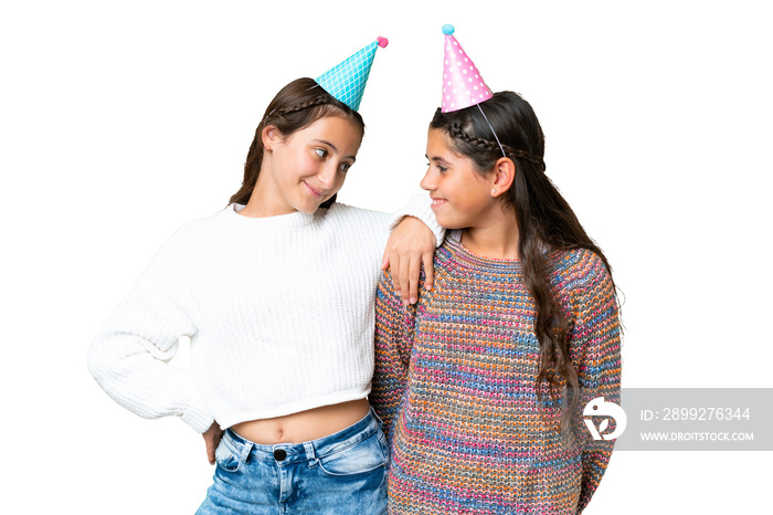 Friends girls in a birthday over isolated chroma key background