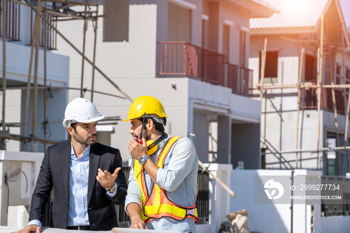 Architect and engineer foreman in helmet working on a building site,Civil engineer project construction work.