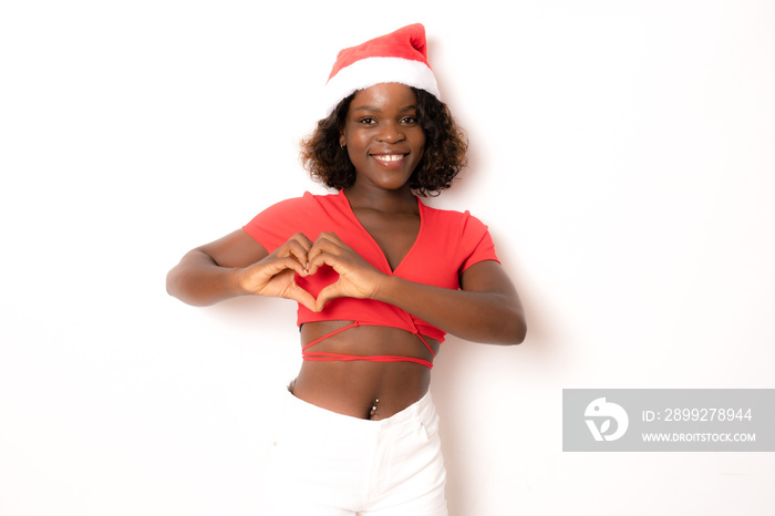 Beautiful smiling happy african american black woman in Santa Claus clothes showing heart shape with hands isolated over white background. Christmas concept.