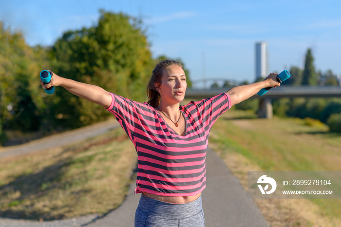 Fit woman working out in a city park