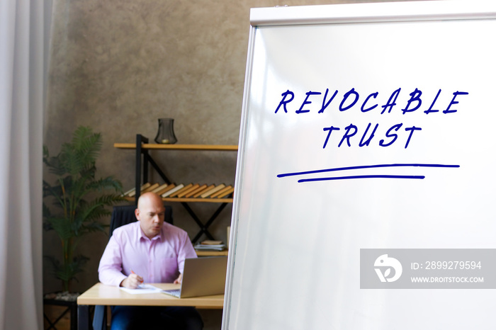 Conceptual photo about REVOCABLE TRUST with handwritten text.