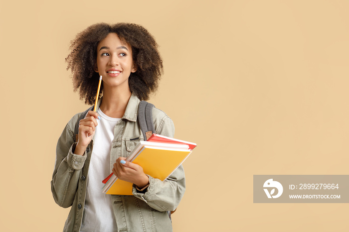 Modern education and student emotions. Pensive african american woman with backpack and notepads holding pencil and looks at free space