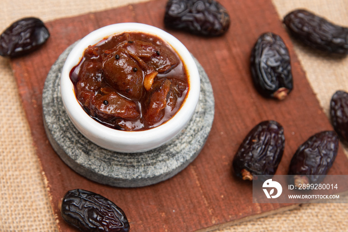 Dates fruit pickle spicy. Dates Tamarind Chutney. Dates crushed to paste with Imli or imalee paste and served as a side dish in Kerala India. Indian pickle.