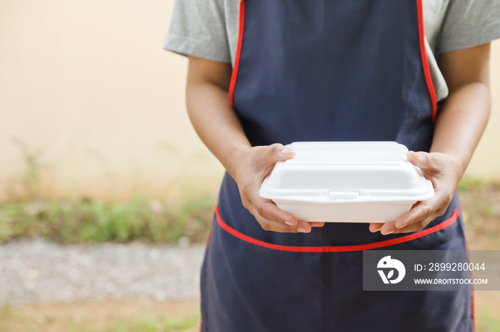 Hand holding empty styrofoam box.Dangerous of styrofoam box.