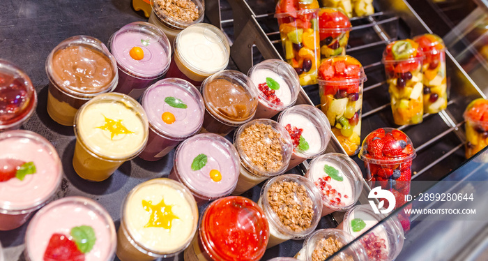 assortment of yogurt on display for sale at convenience store