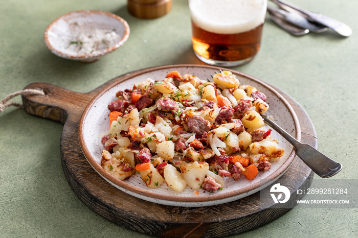 Corned beef hash with potatoes, cabbage and carrot