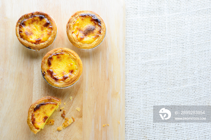 Portuguese Egg Tarts, is a kind of custard tart found in various Asian countries. The dish consists of an outer pastry crust and is filled with egg custard and baked.