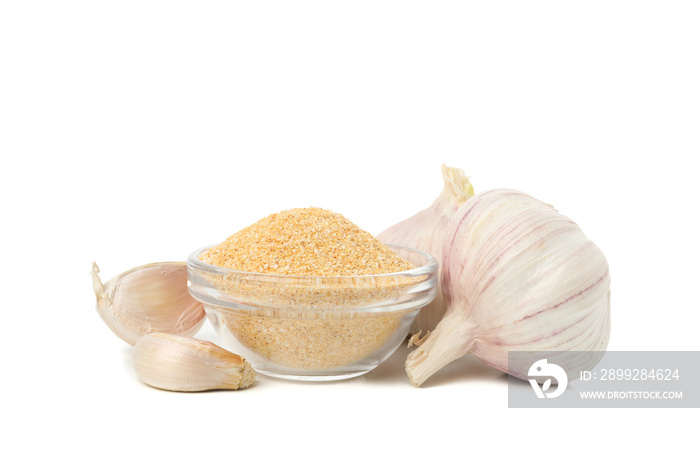 Bowl with garlic powder isolated on white background