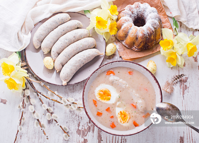 Easter breakfast. Sour rye soup with eggs and sausage