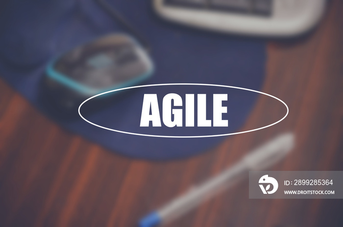 Agile word with business blurring background