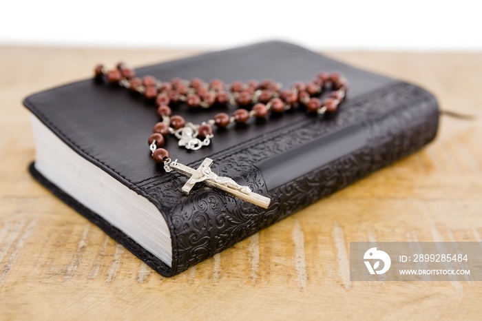 Close-up of bible and rosary beads