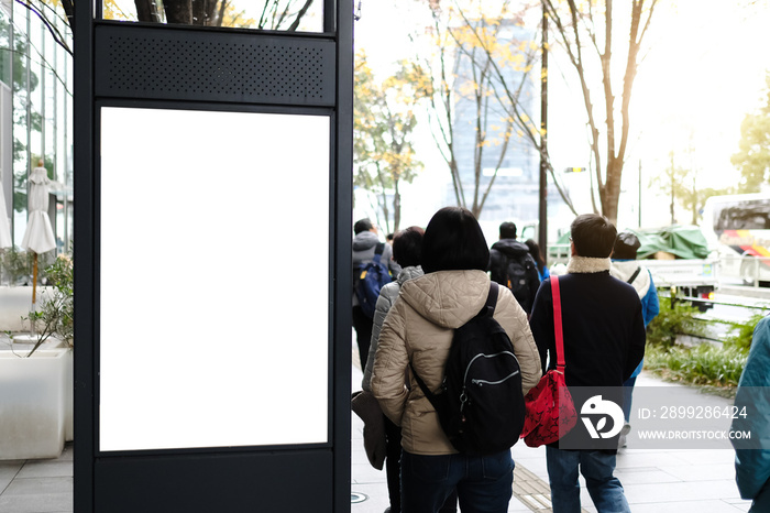 Blank white mockup of bus stop vertical billboard in front of empty street background.