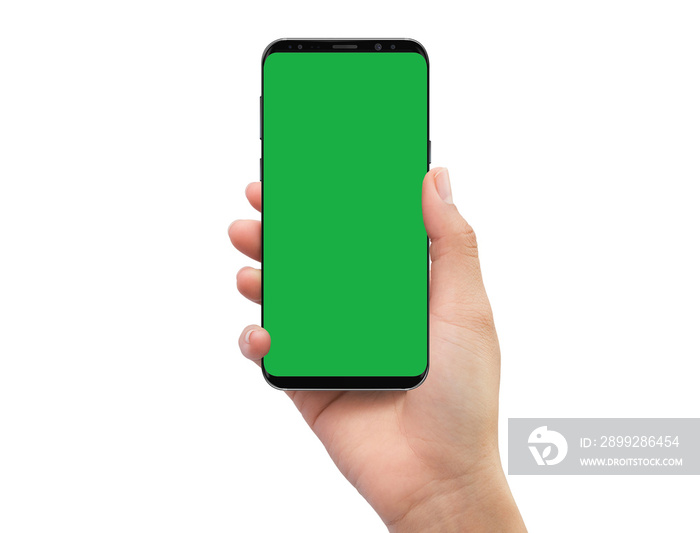 Isolated human right hand holding black mobile green screen smartphone