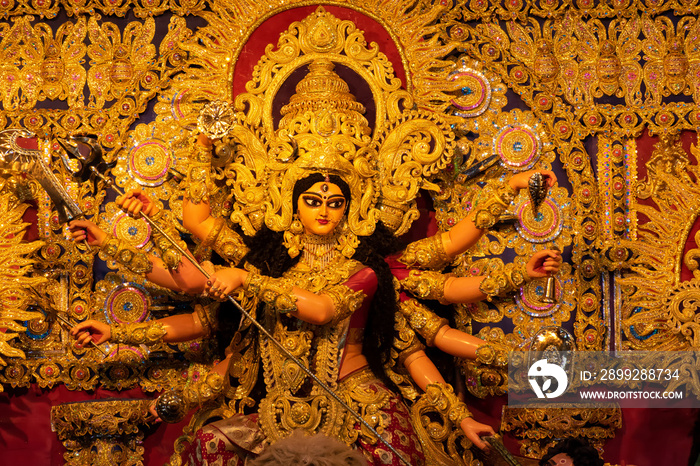 Idol of Goddess Devi Durga at a decorated puja pandal in Kolkata, West Bengal, India. Durga Puja is a popular and major religious festival of Hinduism that is celebrated throughout the world.