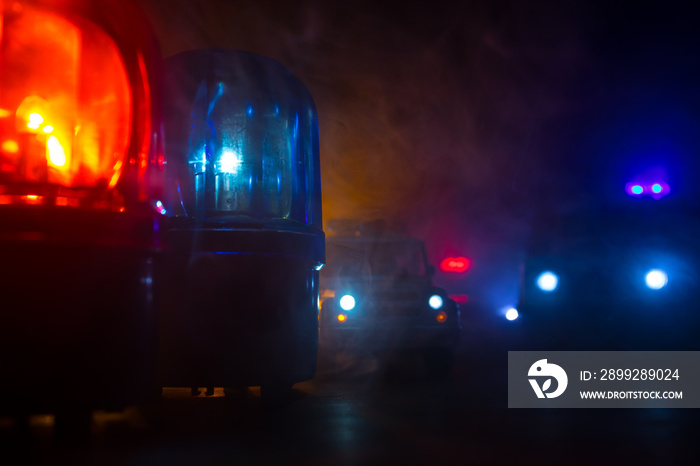 Police car blue and red round vintage siren in dark. Rotating retro style police siren in dark.