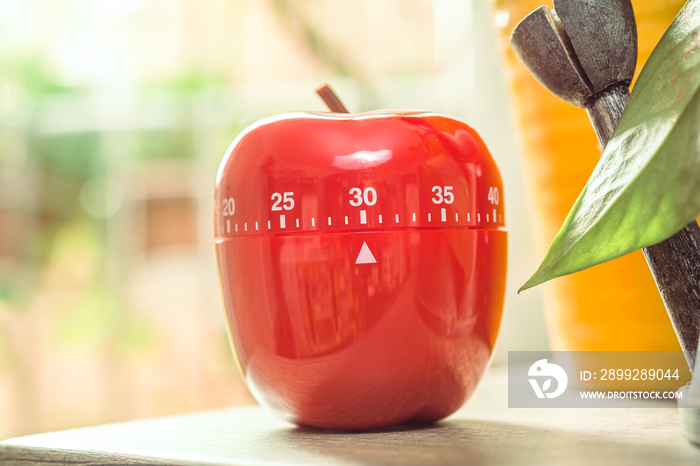 30 Minutes - Red Kitchen Egg Timer Next To A Windows And Flowerpots